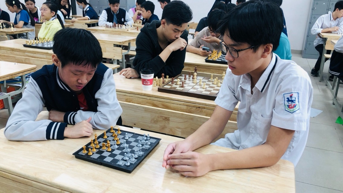 A group of people playing chessDescription automatically generated