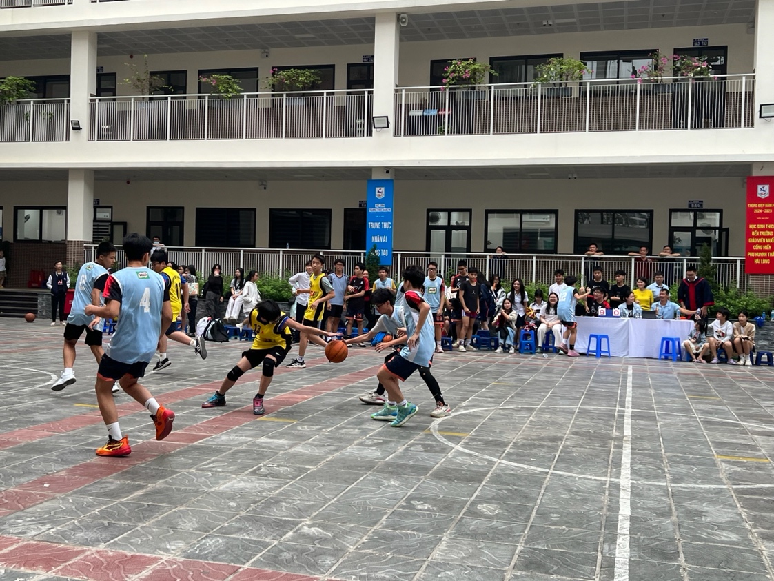 A group of people playing basketballDescription automatically generated