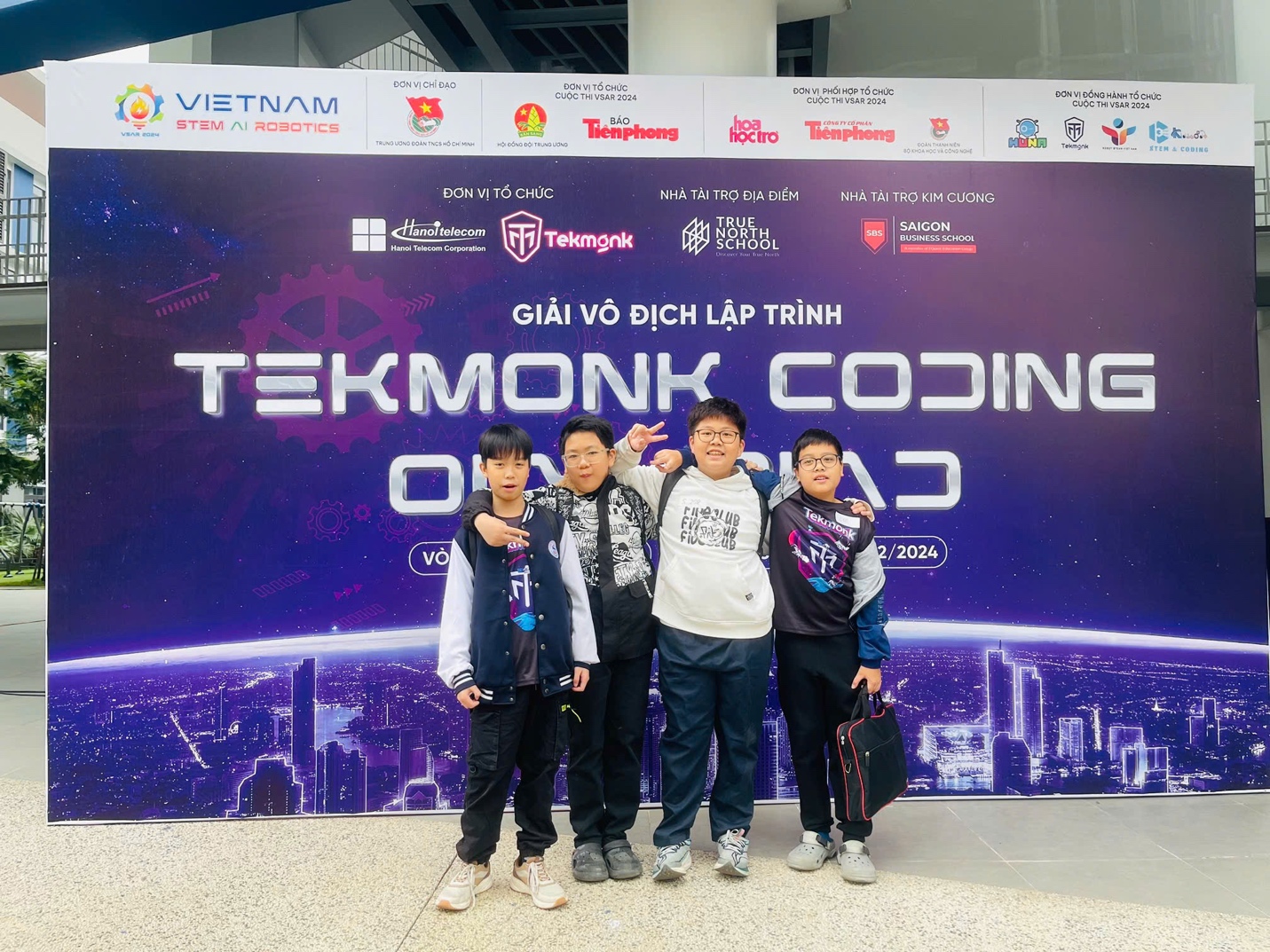 A group of people posing for a photoDescription automatically generated