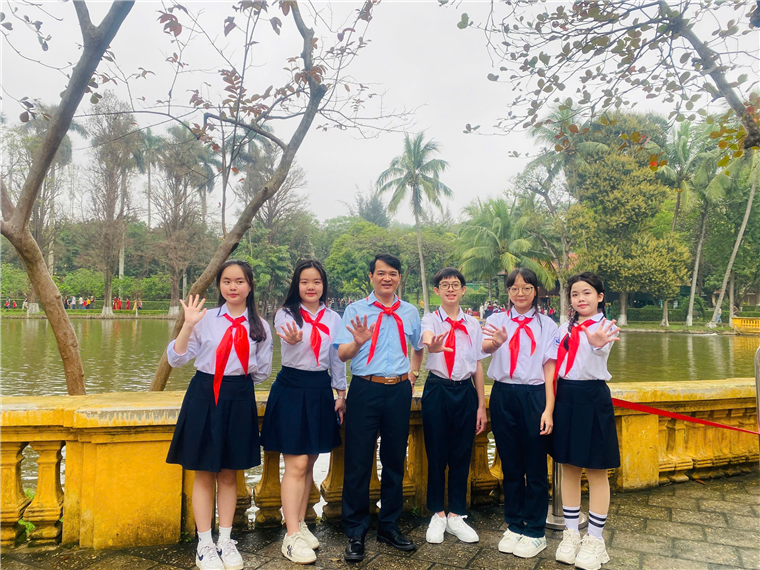 A group of people posing for a photoAI-generated content may be incorrect.