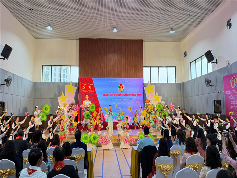 A group of people sitting in chairs in a room with a stage with a stage with a stage with a stage with a stage with a stage with a stage with a stage with a stage with aAI-generated content may be incorrect.
